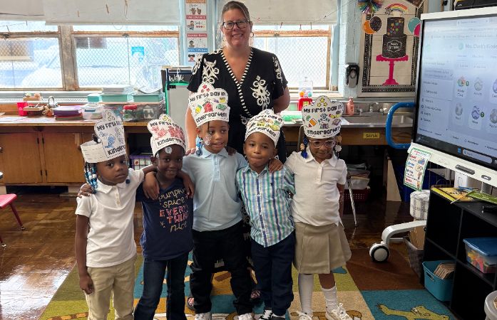  Kinder Students on the First Day of school standing for a quick photo teacher